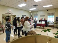 Dana Chapman's Health Science classes gave the local nursing home Christmas gifts and sang carols to the residents.