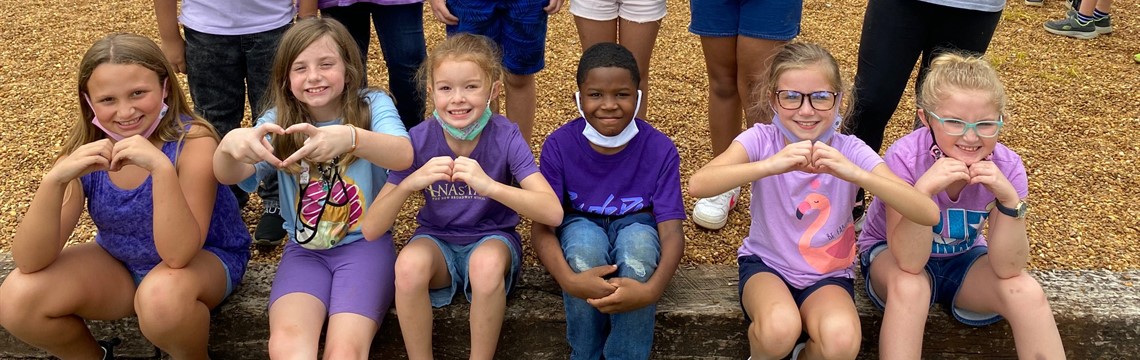 These kids wore purple in honor of Mrs. Carla!
