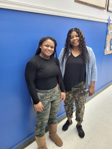 Senior Larti Foote and Coach Chills showing off their Camo for Red Ribbon Week 2022