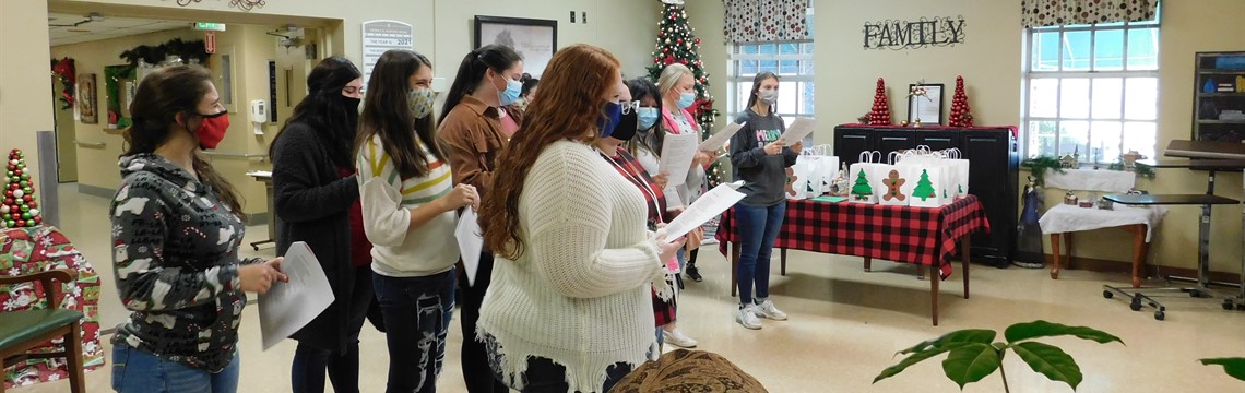 Dana Chapman's Health Science classes gave the local nursing home Christmas gifts and sang carols to the residents.