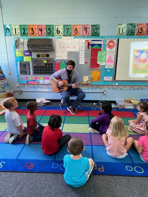 Mr. Knight practicing the colors songs with the kindergarten classes. 
